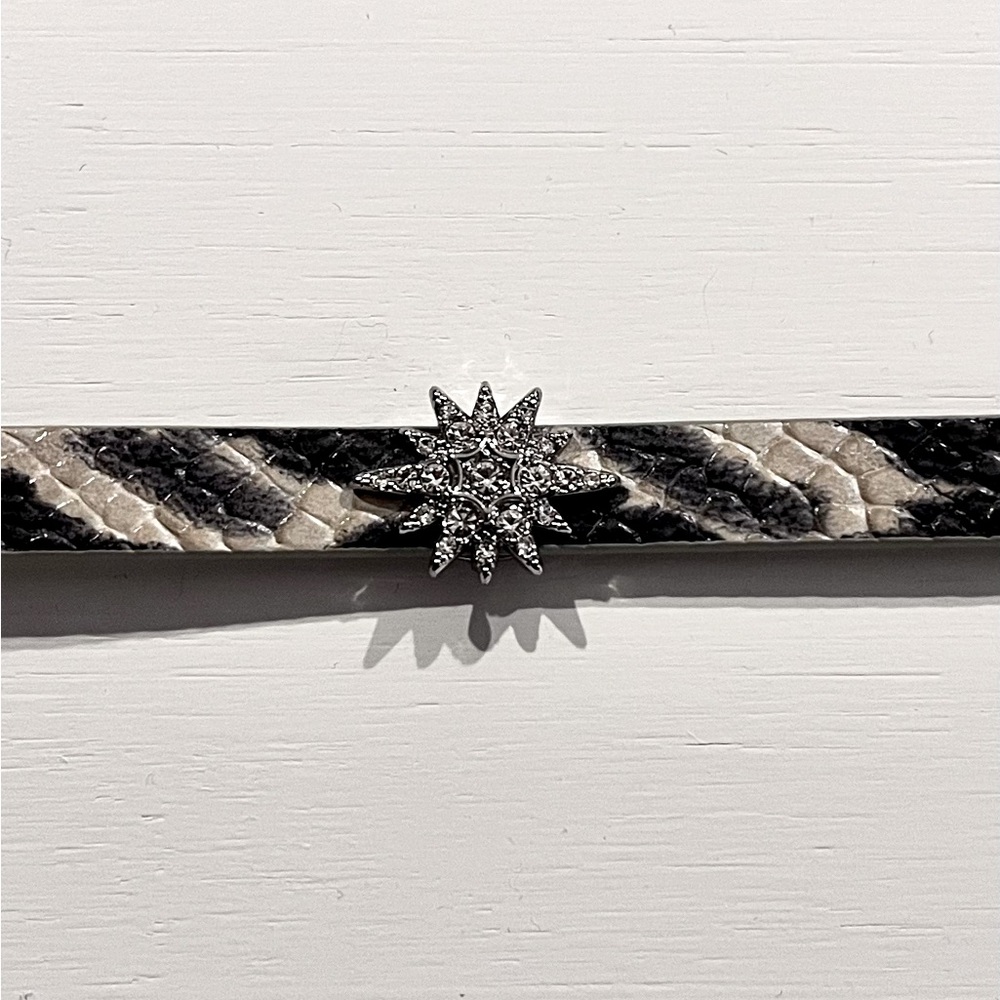 Reversible leather bracelet with jewel encrusted star charm